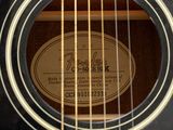 a close up of a guitar with a label on it