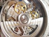 a close up view of a watch with a metal case