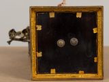 a small clock that is sitting on a table