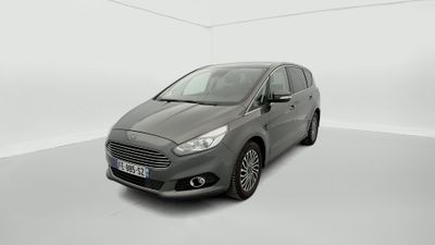 a grey car in a white room with a white floor