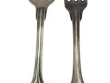 two spoons and a fork sitting next to each other