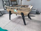 a foosball table in the middle of a pool