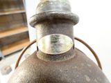 a close up of a metal object with a ring on it