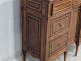 a wooden cabinet with a marble top in a room