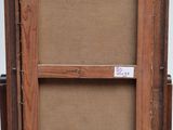 an old wooden easel with a piece of cardboard on top of it