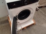 an image of a washing machine with a door open