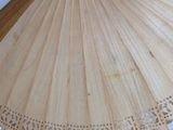 a close up of a wooden umbrella on a table