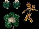three pieces of jewelry including a broochle, earrings and a broochle