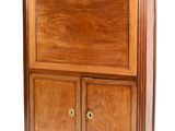a wooden cabinet with a marble top on a white background