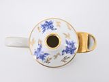 an overhead view of a coffee cup with a saucer in the middle