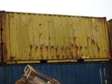 a stack of wooden pallets sitting on top of a shipping container