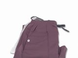 the back of a pair of purple pants on a white background