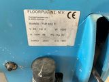 a close up of a blue machine with a label on it