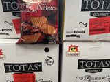boxes of potato chips stacked on top of each other in a store