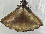antique brass scallop bowl with flowers and leaves on it
