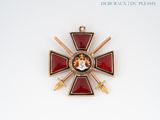 a red and gold cross on a white background