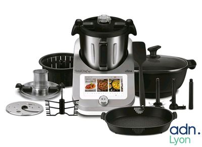 an image of a blender with a variety of cooking utensils
