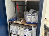 many boxes on the shelves in the room