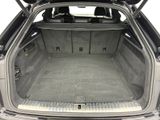 a trunk of a car with the back seats folded down
