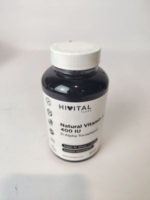 a bottle of vitamin supplement sitting on a table