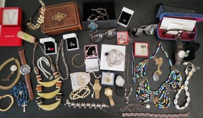 a lot of jewelry that is on the table