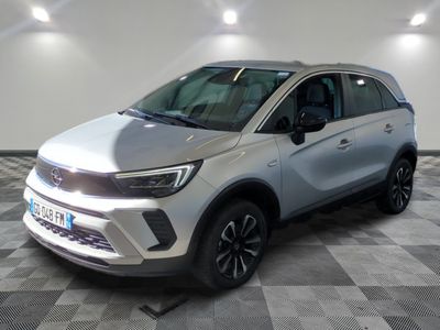 the silver suv is parked on a checkered floor in a room
