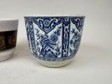 two cups sitting next to each other on a table