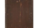 an old wooden cabinet with a brown door and a white wall