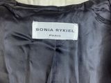 a close up of a black jacket with a label on it