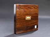 an image of a small wooden box with a label on it