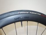 a close up of a bicycle tire on a wall
