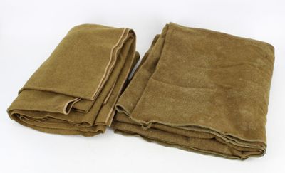 three brown blankets folded on top of each other