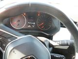 dashboard of a car with a steering wheel and gauges on it