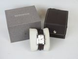 a watch that is sitting in a box on the table