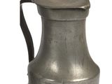 a silver pitcher with a handle on a white background