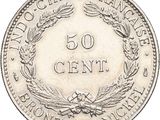 a close up of a coin with a wreath on it