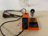 a soldering machine that is sitting on a table