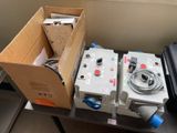 two boxes of electronic equipment sitting on a table