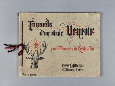un vieux livre sur lequel figurent une tête de cerf et une croix