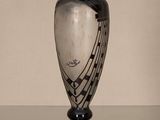 a black and white vase with musical notes on it