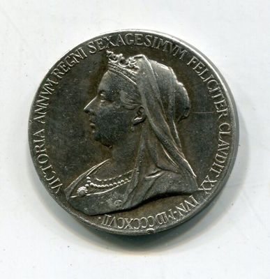une vieille pièce d'argent sur laquelle figure le profil d'une femme