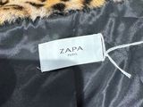 a leopard print jacket with a label on it