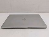 a laptop that is sitting on a white table
