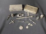 a lot of silver items that are on a table