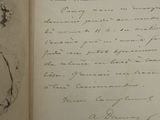 an open book with a handwritten letter and a drawing on it