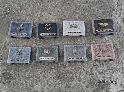 many plaques on the ground with names on them