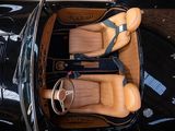 two leather seats in the back of a black car