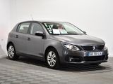 the grey car is parked in a white room with a checkered floor