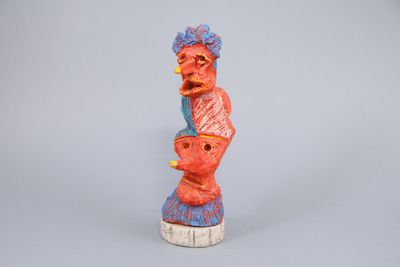 figurine of a woman holding a baby in her arms