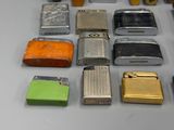 a lot of different types of lighters on the table